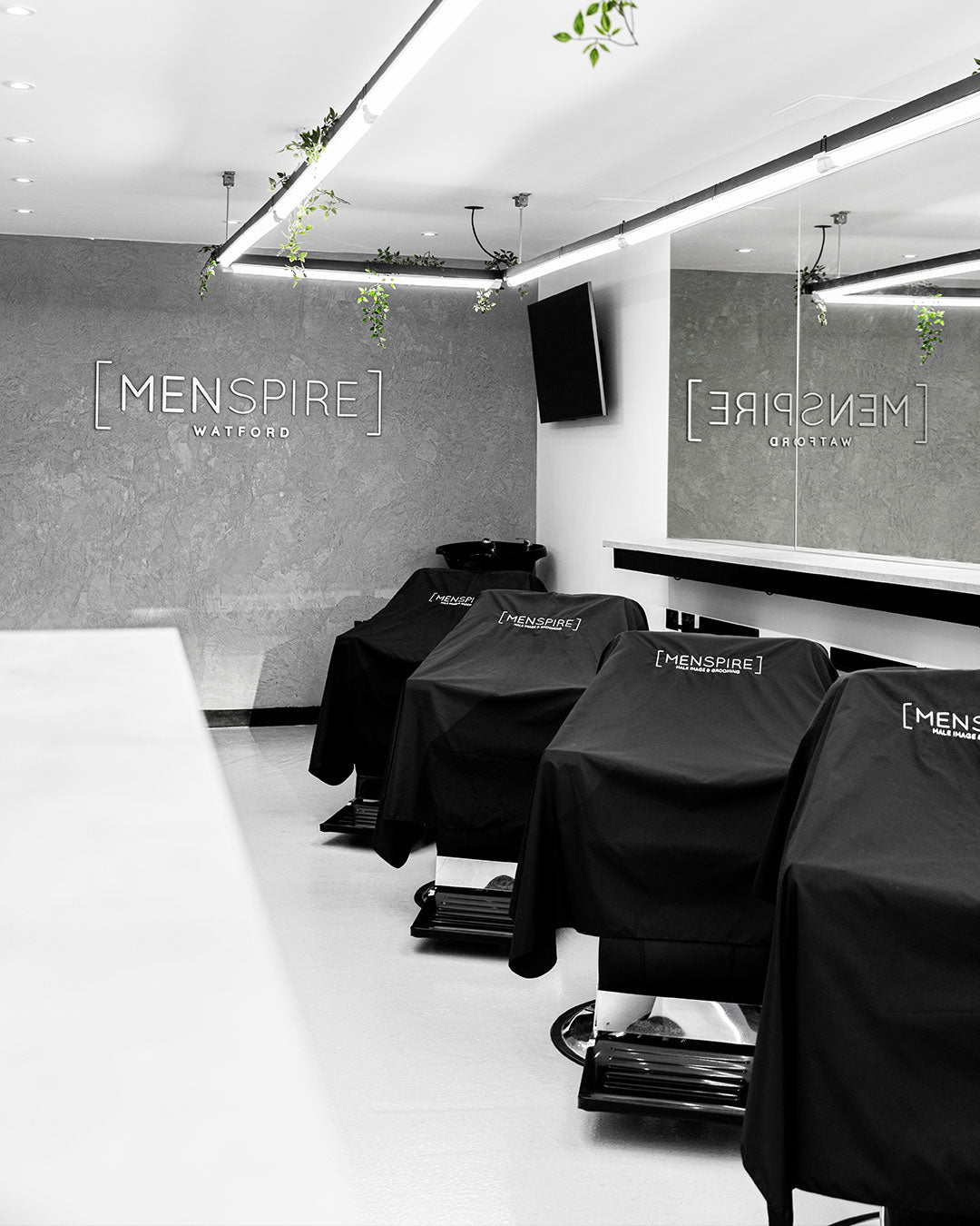 MENSPIRE salon reflecting the brand’s innovative approach to men’s grooming, featuring contemporary design, expert barbers, and a focus on delivering a luxury grooming experience