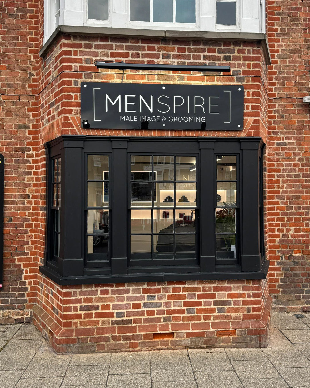 MENSPIRE salon reflecting the brand’s innovative approach to men’s grooming, featuring contemporary design, expert barbers, and a focus on delivering a luxury grooming experience