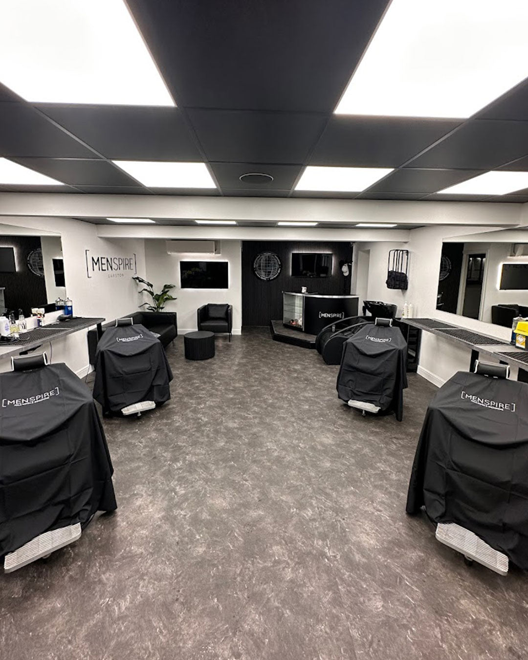 MENSPIRE salon reflecting the brand’s innovative approach to men’s grooming, featuring contemporary design, expert barbers, and a focus on delivering a luxury grooming experience