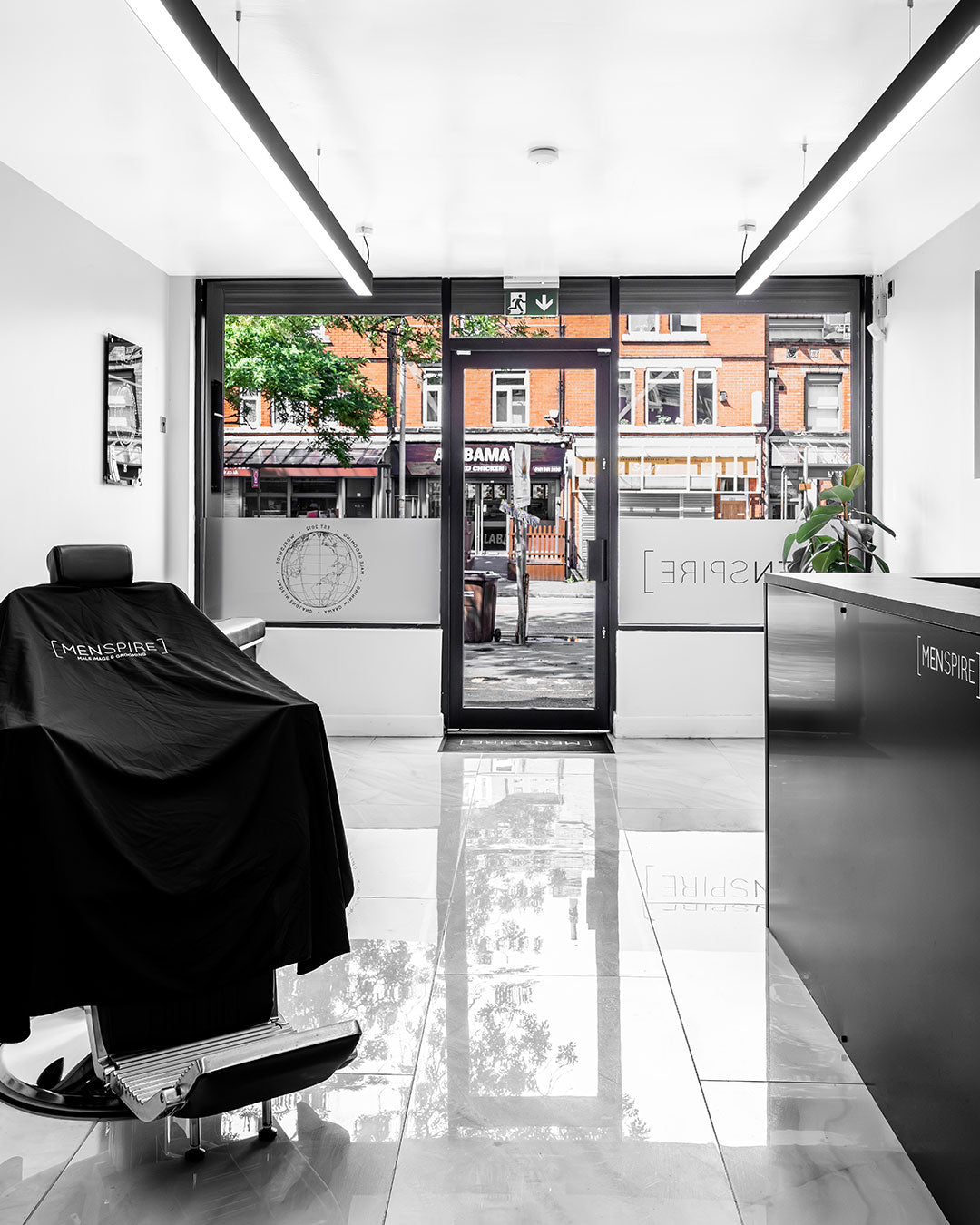 MENSPIRE salon reflecting the brand’s innovative approach to men’s grooming, featuring contemporary design, expert barbers, and a focus on delivering a luxury grooming experience