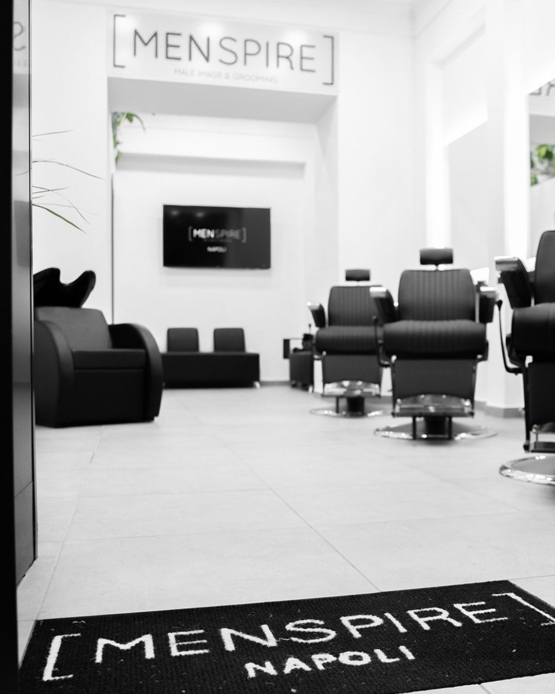 MENSPIRE salon reflecting the brand’s innovative approach to men’s grooming, featuring contemporary design, expert barbers, and a focus on delivering a luxury grooming experience