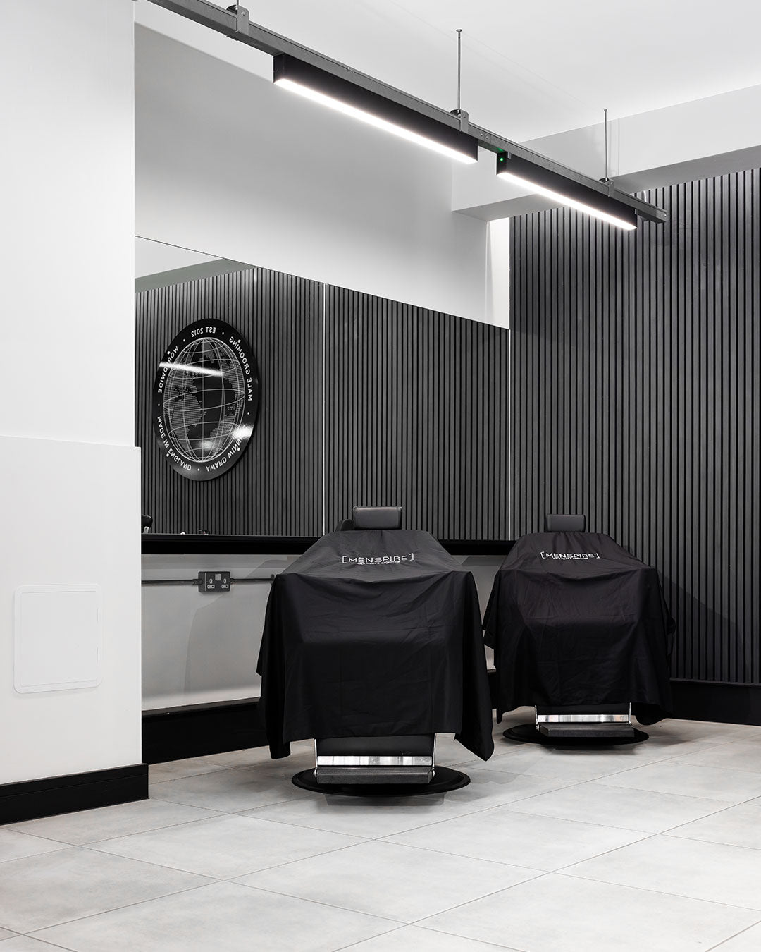 MENSPIRE salon reflecting the brand’s innovative approach to men’s grooming, featuring contemporary design, expert barbers, and a focus on delivering a luxury grooming experience
