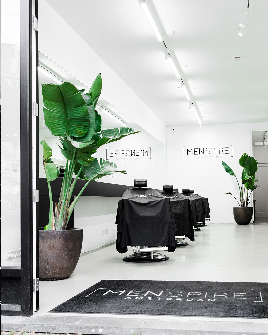 MENSPIRE salon reflecting the brand’s innovative approach to men’s grooming, featuring contemporary design, expert barbers, and a focus on delivering a luxury grooming experience