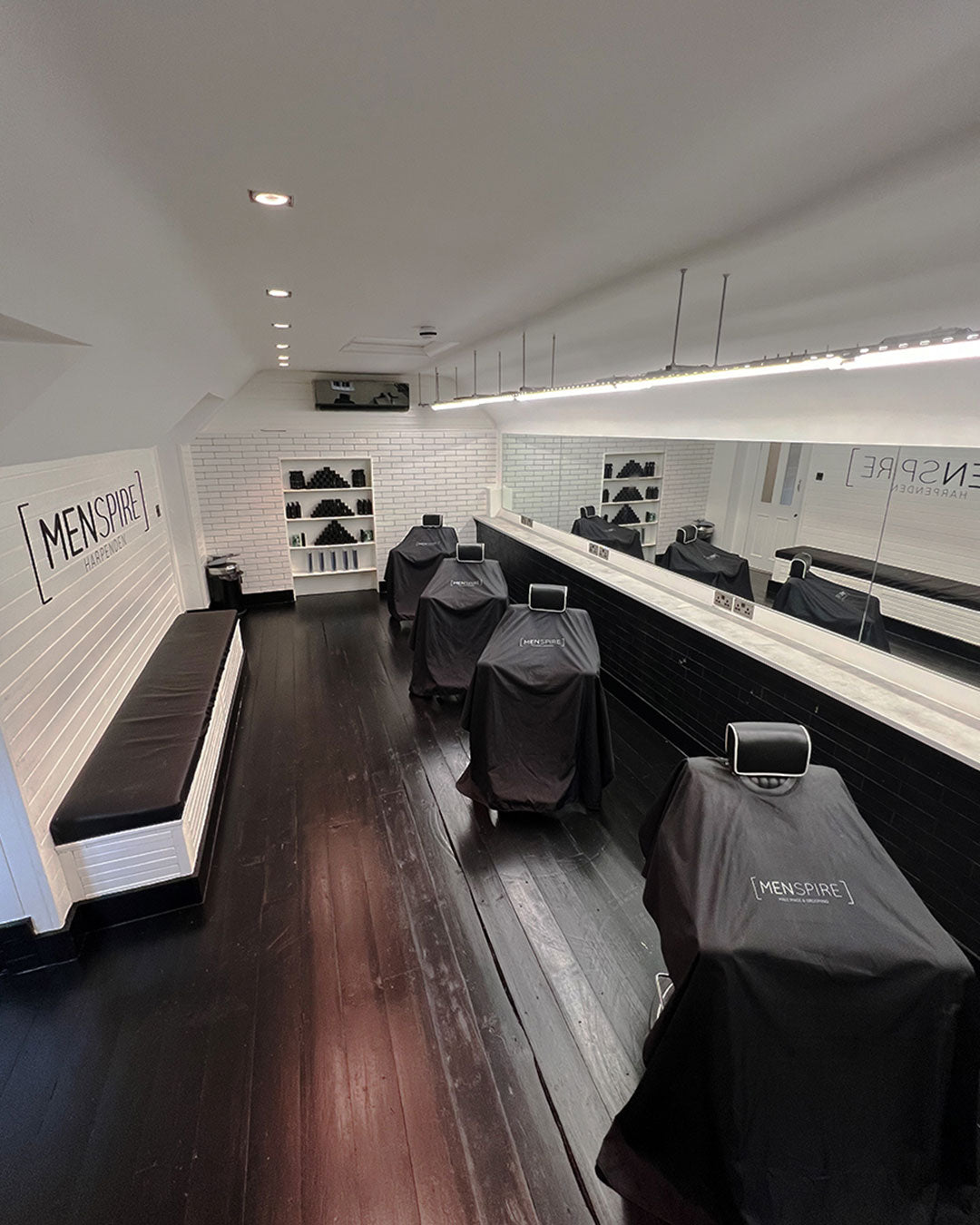 MENSPIRE salon reflecting the brand’s innovative approach to men’s grooming, featuring contemporary design, expert barbers, and a focus on delivering a luxury grooming experience