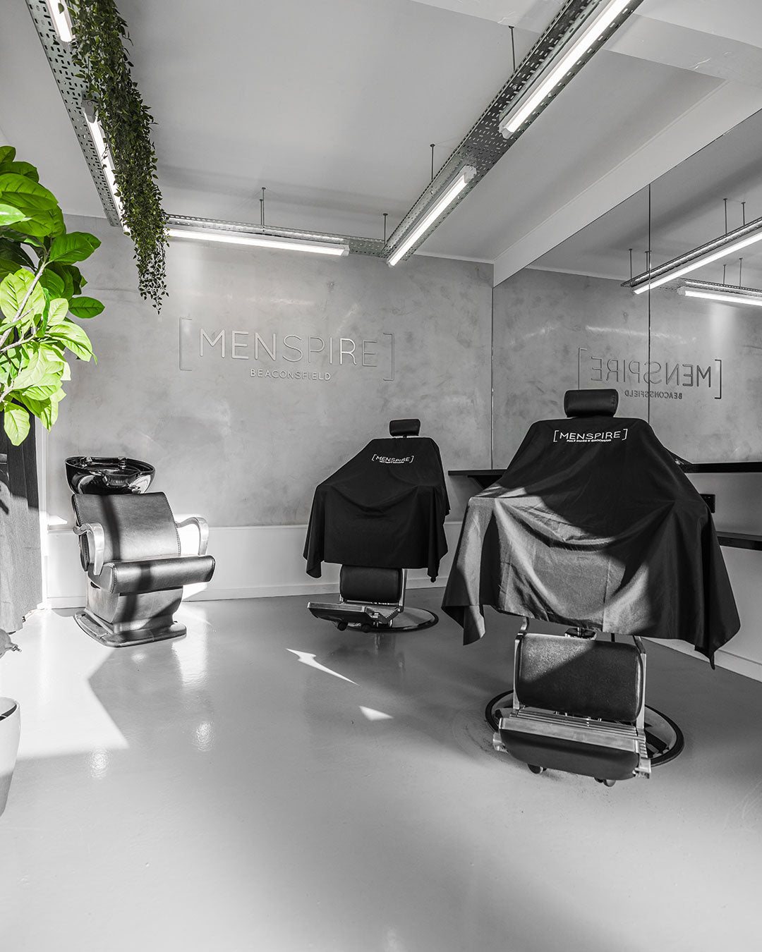 MENSPIRE salon reflecting the brand’s innovative approach to men’s grooming, featuring contemporary design, expert barbers, and a focus on delivering a luxury grooming experience